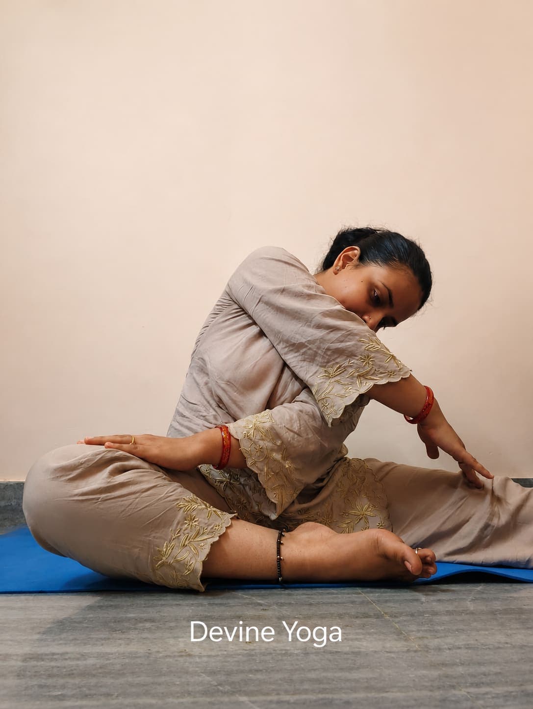 Devine Yoga student 2 practising a pose at home