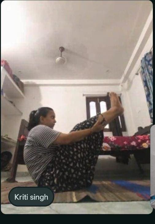 Devine Yoga student 3 practising a pose at home